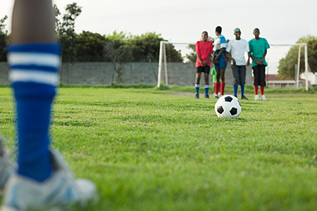 Friends playing football
