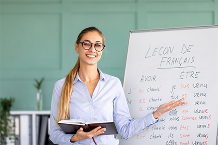 Confident female tutor teaching French