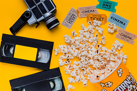 Scattered popcorn box with videotape
