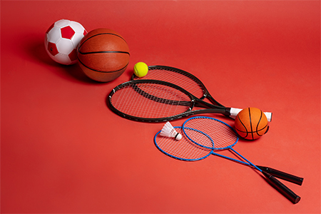Sport equipment flat lay; Variety of rackets and balls