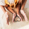 mother and daughter preparing cookies with heart shaped mold in kitchen