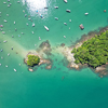 An aerial shot of boats on the sea on a sunny day in Angra dos Reis, Brazil