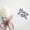 white paper sign wishing everyone a joyful 'Happy Easter!'