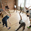 Diverse group of people excercising in a circle