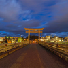 Japanese Torii pole at Miyamae Bridge at night in Takayama old town, Gifu, urban city in Japan