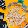 Scattered popcorn box with videotape