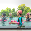 senior aquatic class practicing water relaxation and float