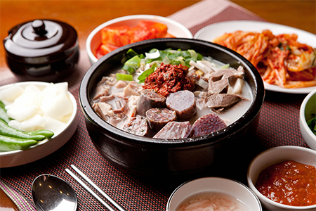 Korean sausage Sundae and rice soup pot with various side dishes, gukbap