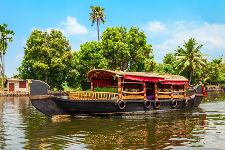 A houseboat sailing in Alappuzha backwaters in Kerala state in India