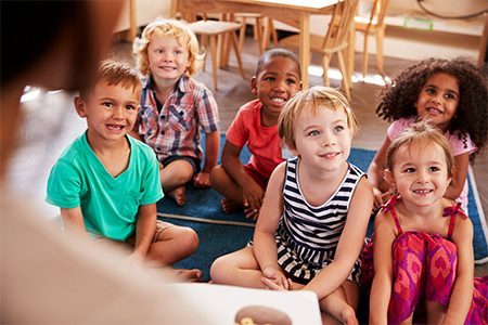 Students listening to the teacher at a daycare