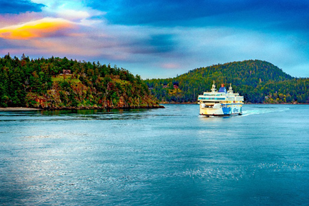 VICTORIA BC - APRIL 8 2018 Large multi-level ferries carry cars, trucks, and passengers hourly betwe