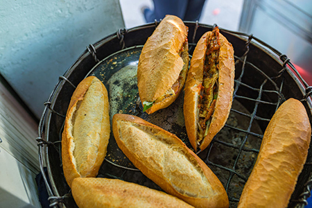 Vietnamese sandwich- Banh Mi on the heating charcoal stove