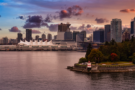 Brockton Point Lighthouse in Stanley Park with downtown Vancouver in the background