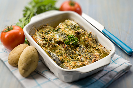 cake with anchovies tomato and potatoes, selective