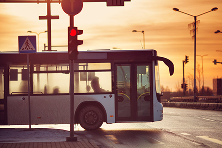 Bus moving on the road in city in early morning