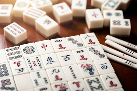 mahjong tiles on wooden table