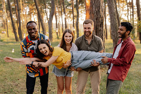 Multiracial group of friends having fun in a park