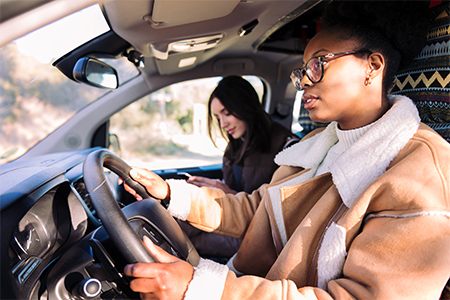 girl driving a car with a female driver examiner