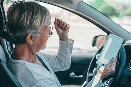 One old woman getting the pass to drive a car