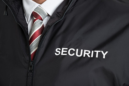 Close-up Of Security Guard Wearing Uniform With The Text Security