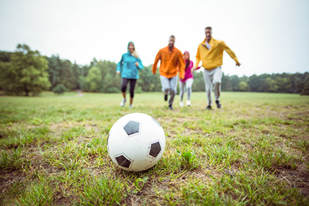 group of friends playing soccer