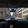 Young driver inside car on the city road