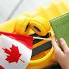 Woman with passport, Canadian flag and luggage, closeup