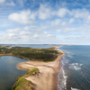 Aerial panoramic view of a beautiful sandy beach on the Atlantic Ocean, Cavendish, Prince Edward Isl