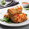 Cabbage rolls with beef, rice and vegetables on the plate. Stuffed cabbage leaves with meat. Gray co