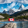 Girl Holding a Canadian National Flag, View of Og Lake in the Iconic Mt Assiniboine Provincial Park 