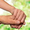 Hands of the old man and a young woman. close up.