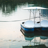 Paddle boat in a dark lake
