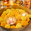 Flowers and Candles Floating in a Bowl