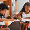 Shot of kids doing their homework together