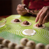 woman preparing dumplings in the kitchen