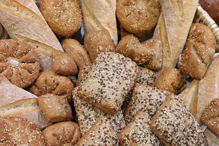 Bread background. Various kinds of bread with sesame seeds.