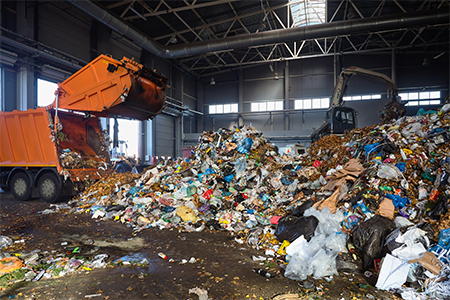 unloading garbage from garbage truck