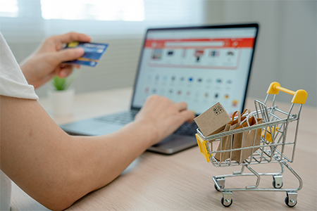 Online shopping-boxes or parcels are placed on the table and shopping carts