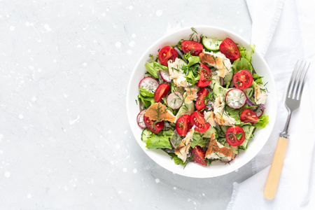 Delicious Fattoush or Arab salad with pita bread, fresh vegetables on plate. Middle Eastern bread sa