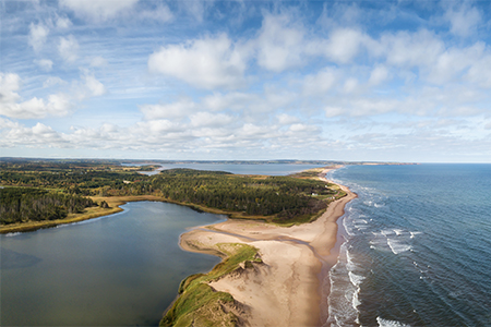 Aerial panoramic view of a beautiful sandy beach on the Atlantic Ocean, Cavendish, Prince Edward Isl