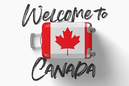 Welcome to Canada written on white background with Canada flag on suitcase