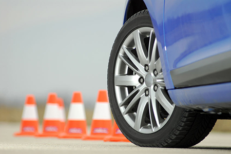 sport wheel photographed with red and white cones