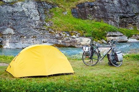 Tents, bikes, next to lake