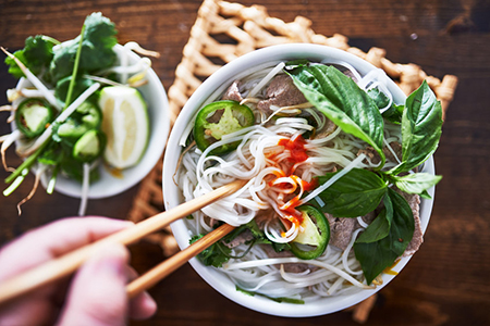 ietnamese pho with spicy sriracha sauce shot top down