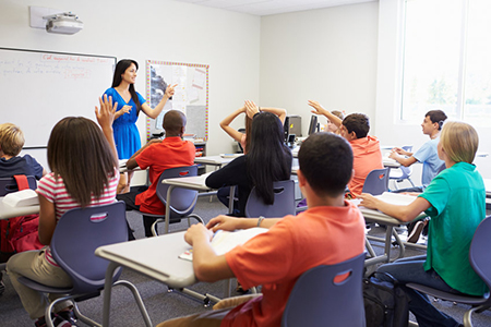 Female High School Teacher Taking Class