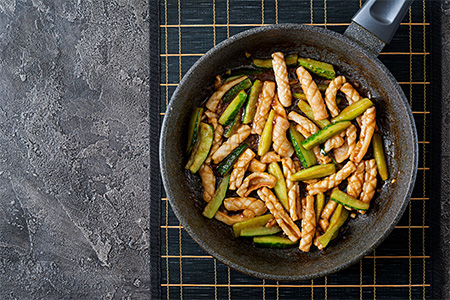 Stir fry chicken and bitter melon prepared with cocos milk, Asian style cuisine