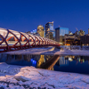 Calgary skyline at night along the Bow River in Calgary, Alberta, Canada