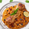 Chicken Kabsa or Chicken Biryani at white wooden background. Kabsa is traditional saudi arabian cuis