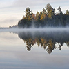 Whitefish Lake in Algonquin Provincial Park. Picture is about beautiful lake with a fog at early mor