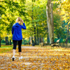 Middle-aged woman walking in city park